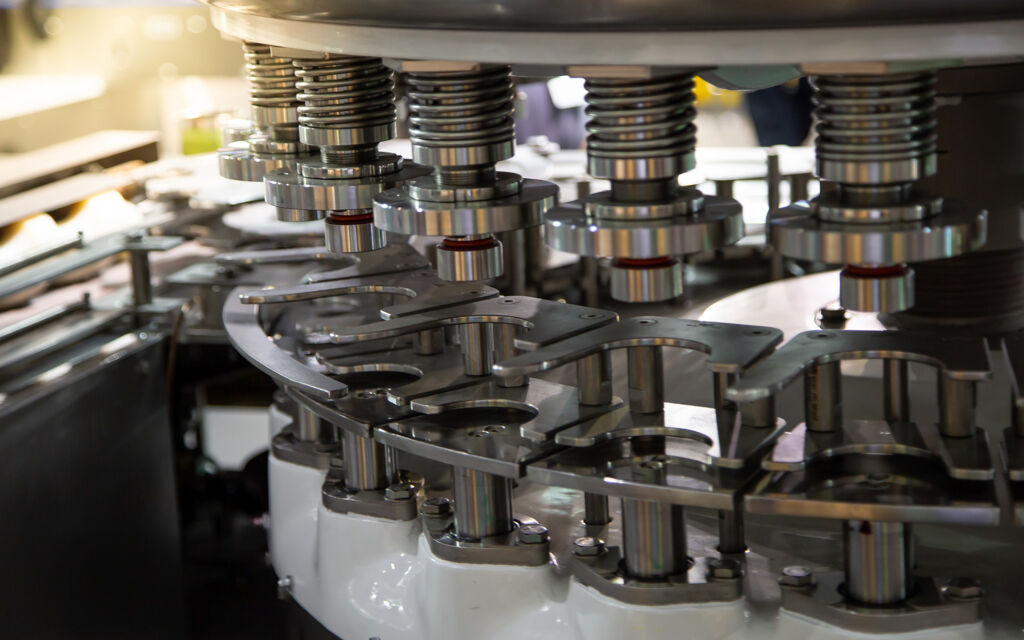 Close-up of food processing machinery with precision-engineered components, highlighting the role of Magnattack magnetic separators in contamination control.